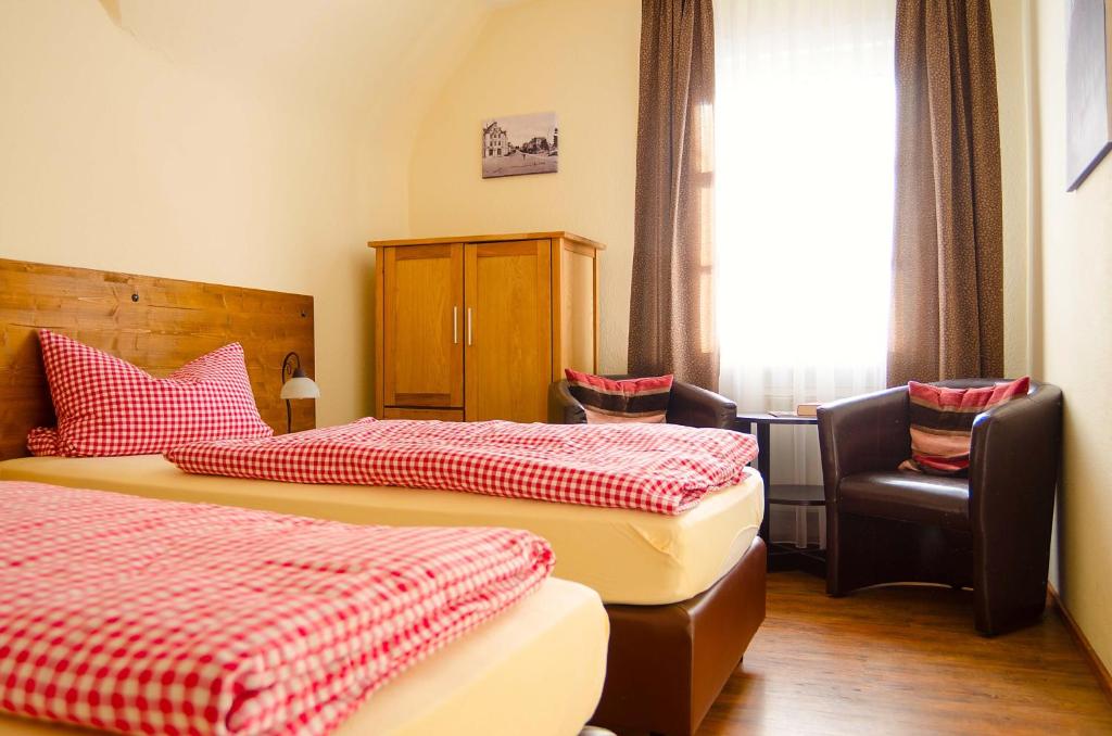 Llit o llits en una habitació de Hotel Am Dalwigker Tor