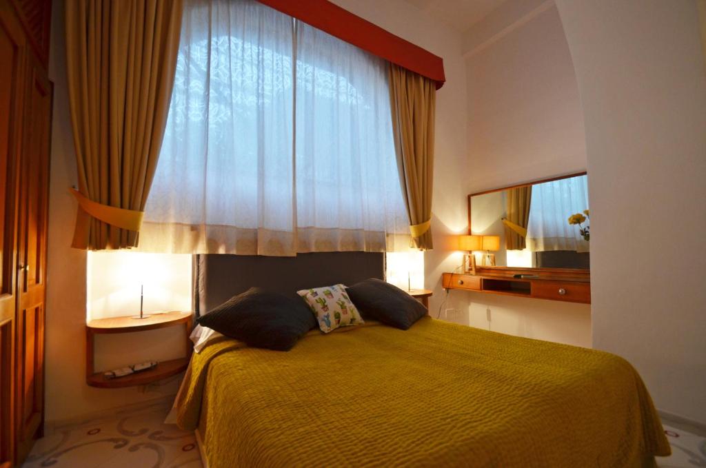 Letto o letti in una camera di Albergo Gatto Bianco