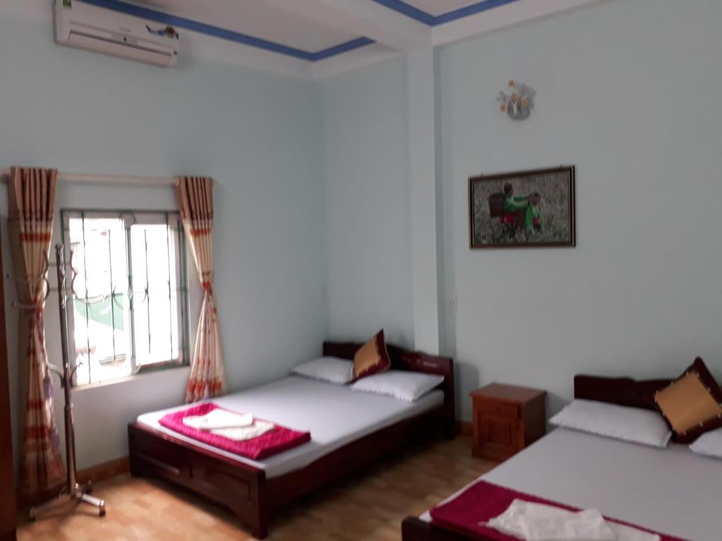 Postel nebo postele na pokoji v ubytování Binh Minh Hostel