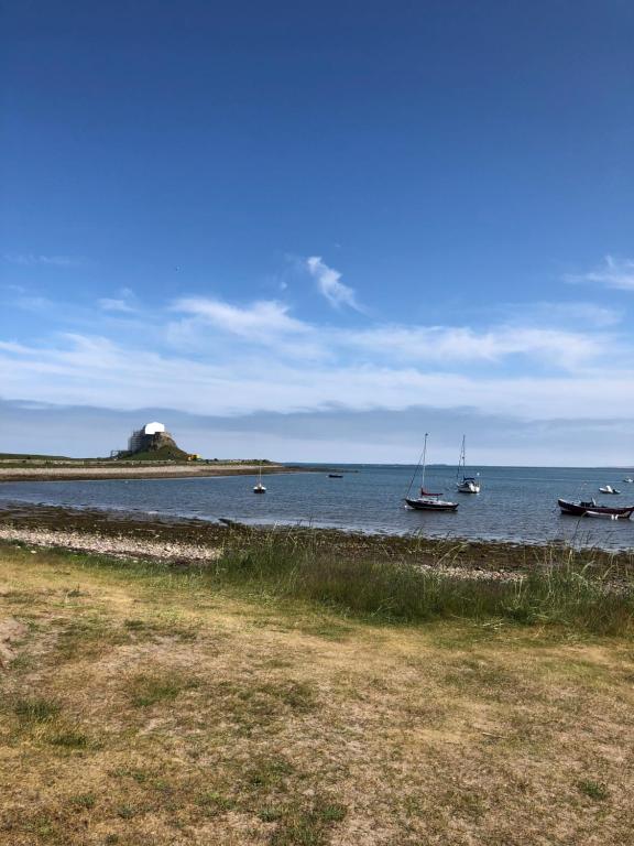 a large body of water with boats in it at The Old Vicarage in Berwick-Upon-Tweed
