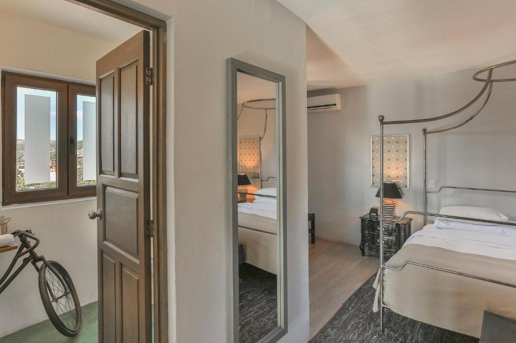 Postel nebo postele na pokoji v ubytování Hotel Boutique El Palomar