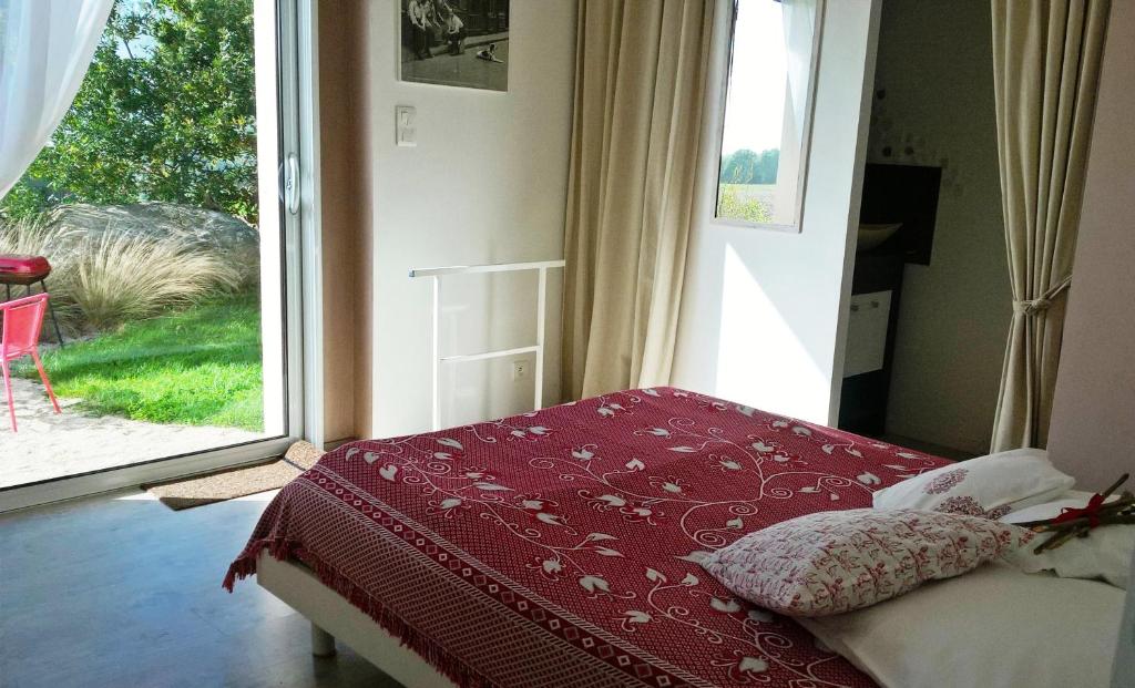 Postel nebo postele na pokoji v ubytování Sud Bretagne Concarneau Tregunc Pont-avenTyruzall