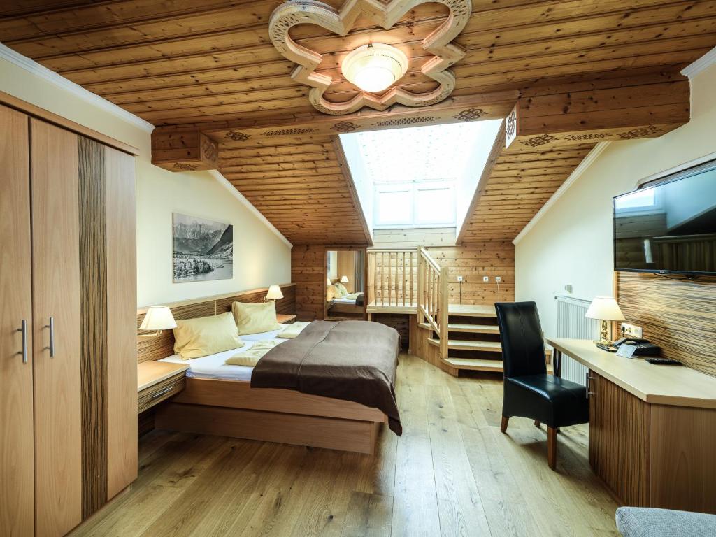 Postel nebo postele na pokoji v ubytování Hotel Victoria