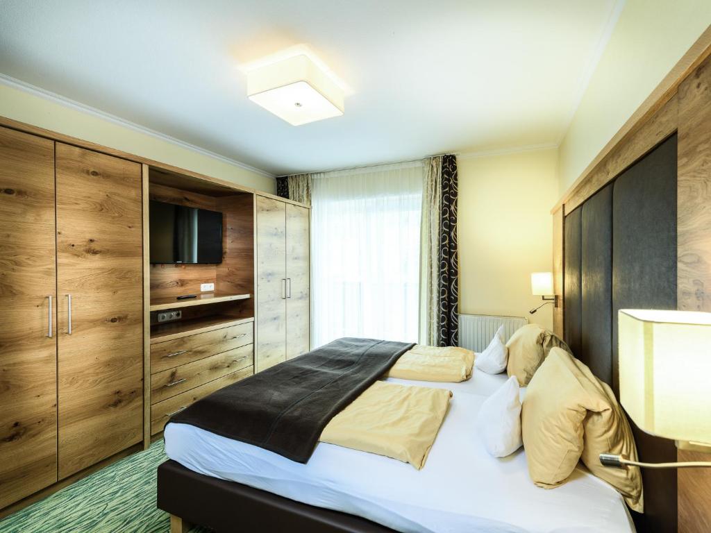 Postel nebo postele na pokoji v ubytování Hotel Victoria