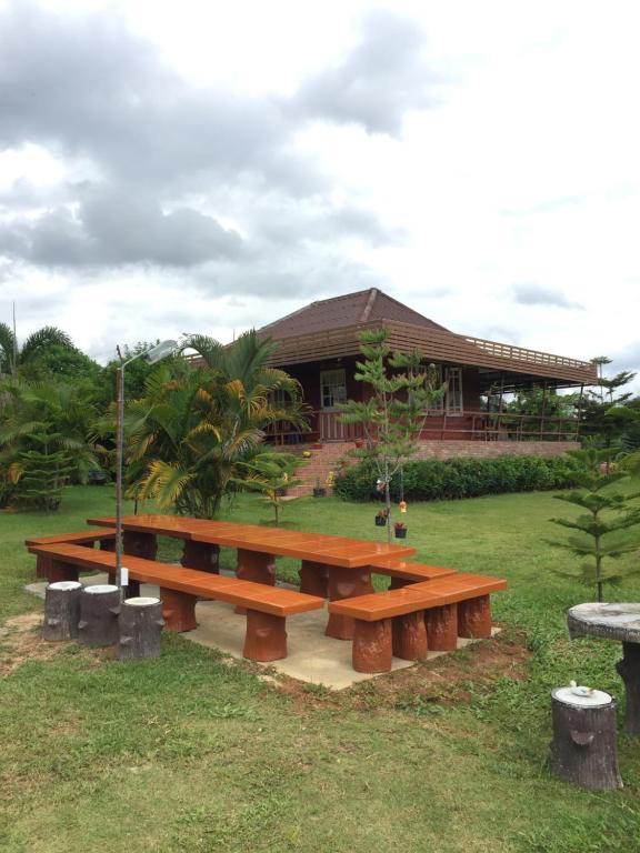 a picnic bench in front of a building at Khao Kho Copter Hill in Ban Khao Ya Nua