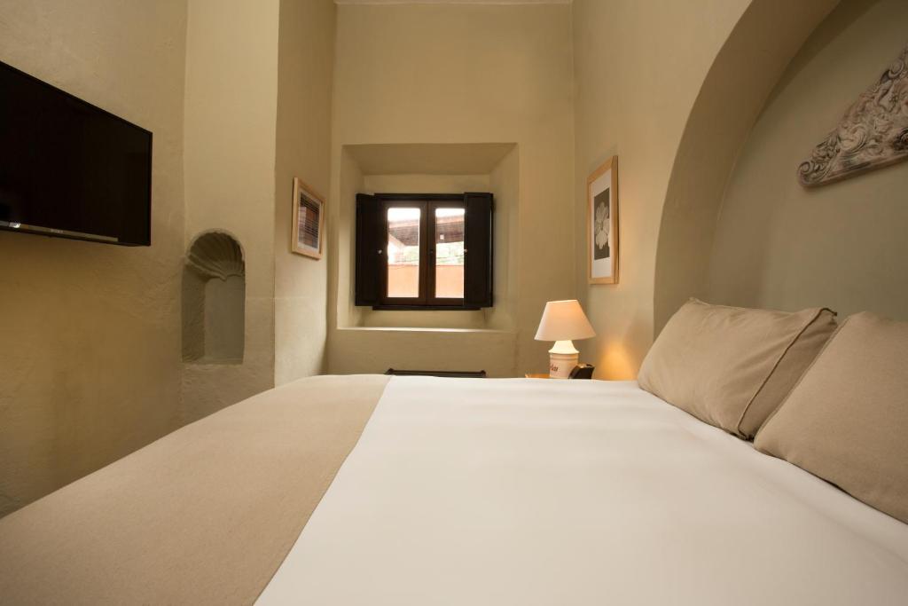Postel nebo postele na pokoji v ubytování Hotel Boutique El Palomar