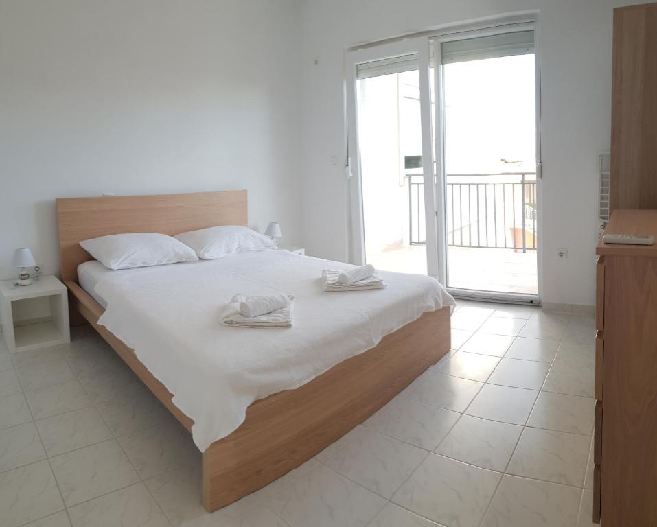 Postel nebo postele na pokoji v ubytování Apartments Toro