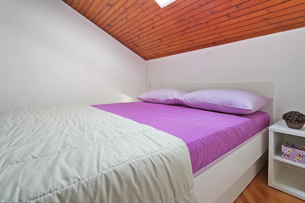 Posteľ alebo postele v izbe v ubytovaní Apartments Skako