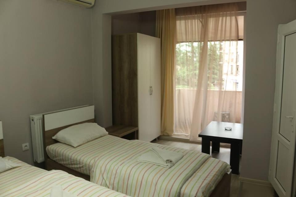 Postel nebo postele na pokoji v ubytování Old Street Guesthouse