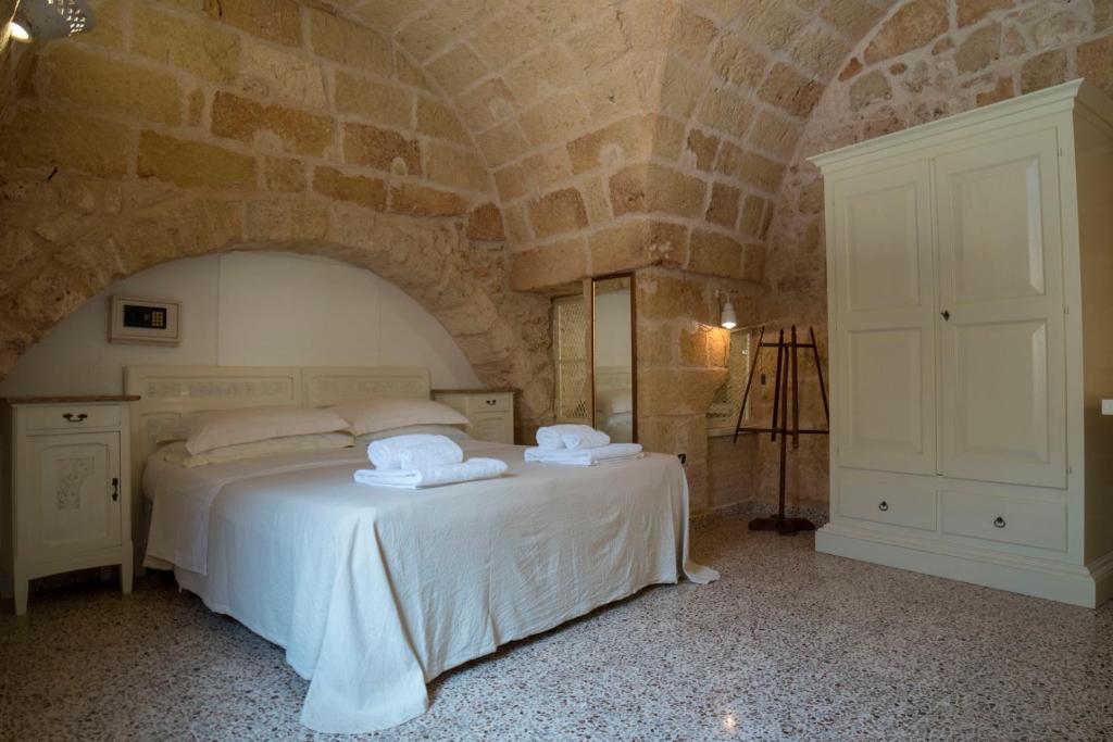 Postel nebo postele na pokoji v ubytování B&B La vecchia Corte