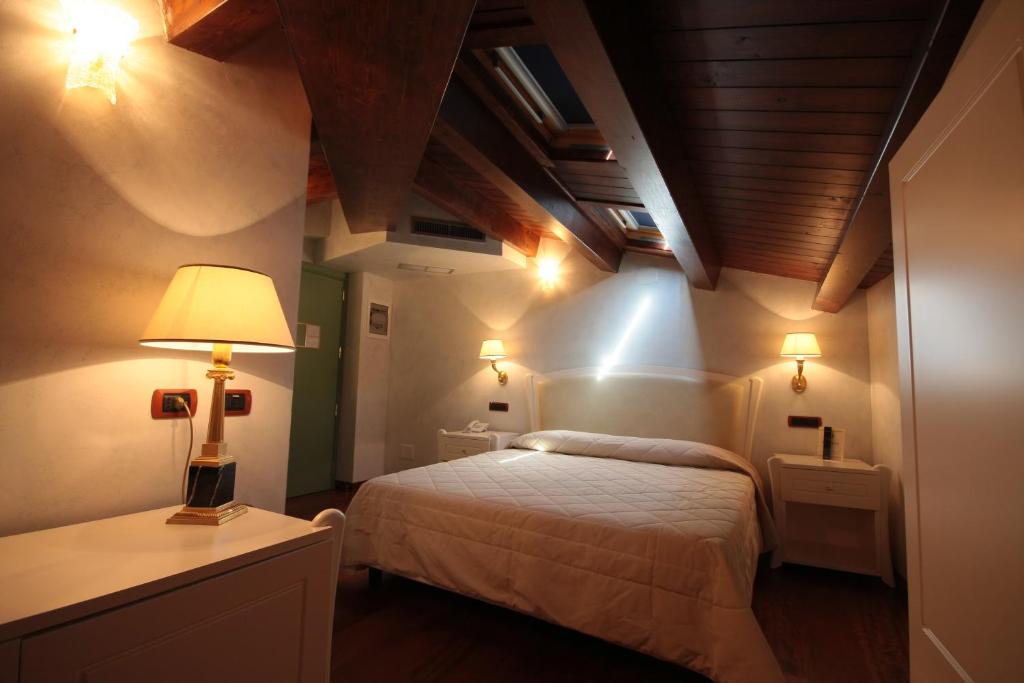 Postel nebo postele na pokoji v ubytování Hotel Rojan