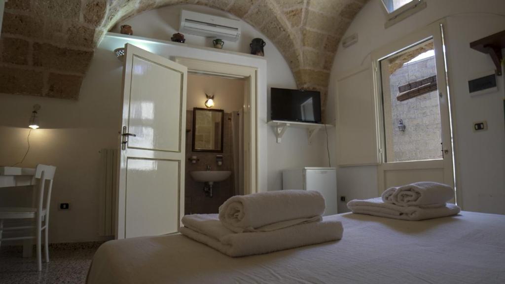 Postel nebo postele na pokoji v ubytování B&B La vecchia Corte