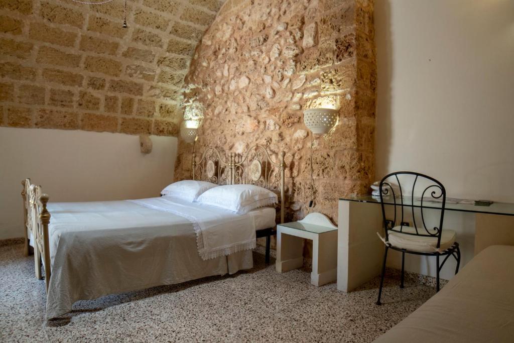 Postel nebo postele na pokoji v ubytování B&B La vecchia Corte