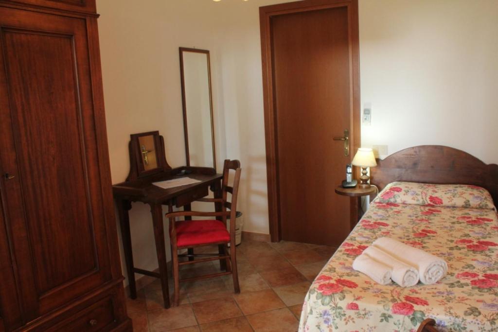 Postel nebo postele na pokoji v ubytování Hotel Residence I Briganti di Capalbio