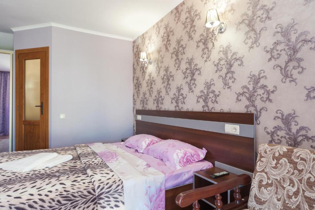 Postel nebo postele na pokoji v ubytování Villa Orchidea