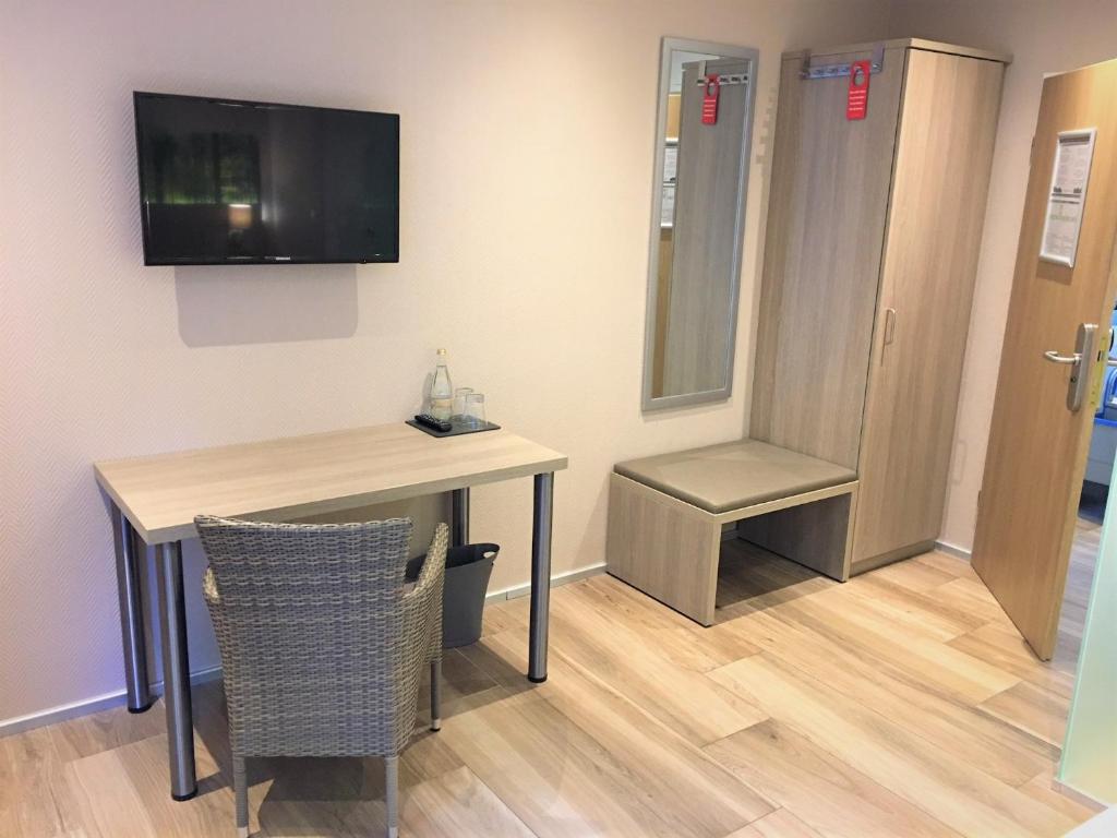 TV a/nebo společenská místnost v ubytování Hotel Scheid