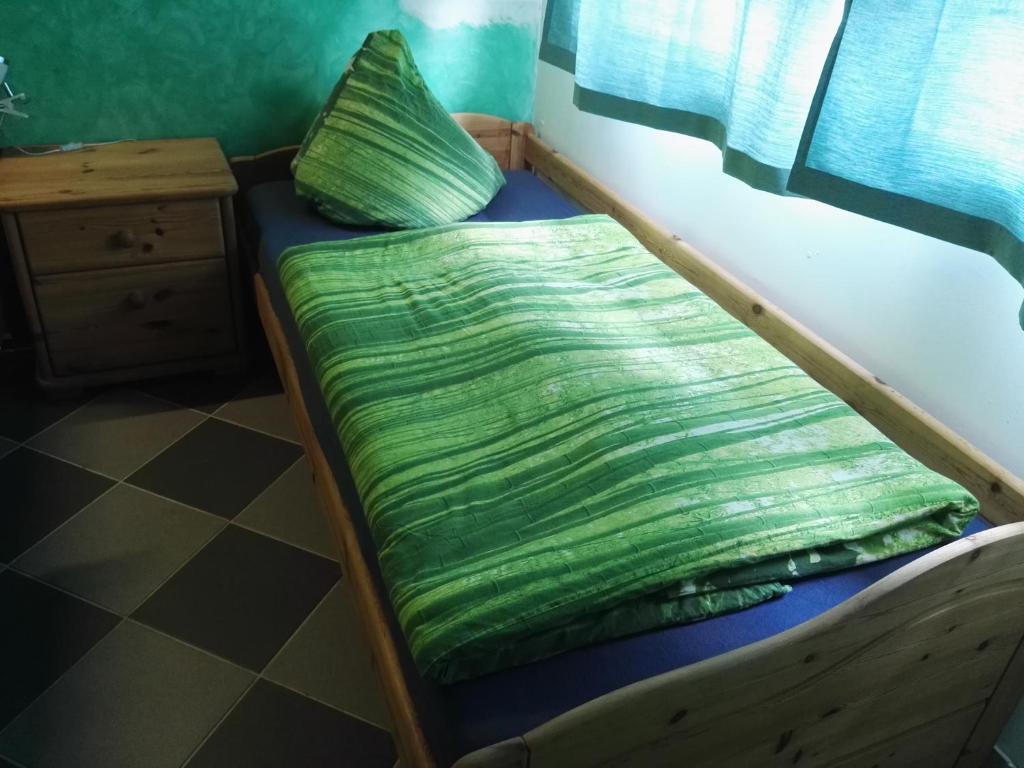 Ein Bett oder Betten in einem Zimmer der Unterkunft Ferienwohnungen mit Weitblick