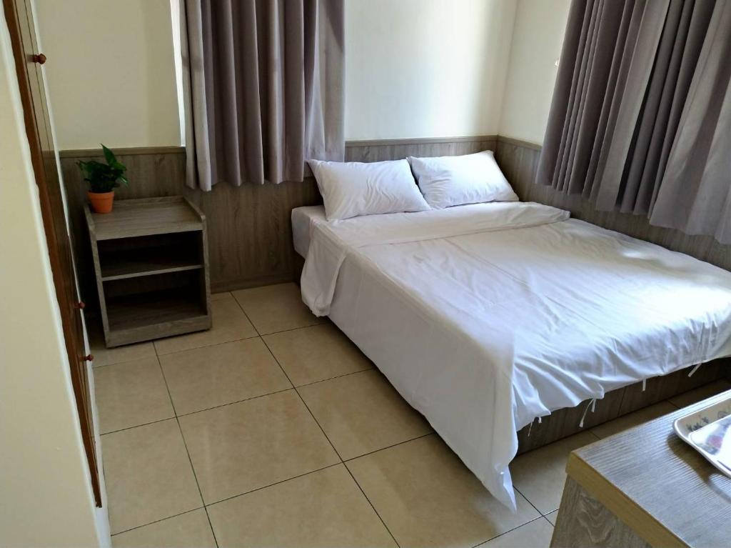 Postel nebo postele na pokoji v ubytování Yahweh Homestay