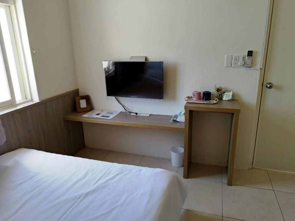 TV a/nebo společenská místnost v ubytování Yahweh Homestay