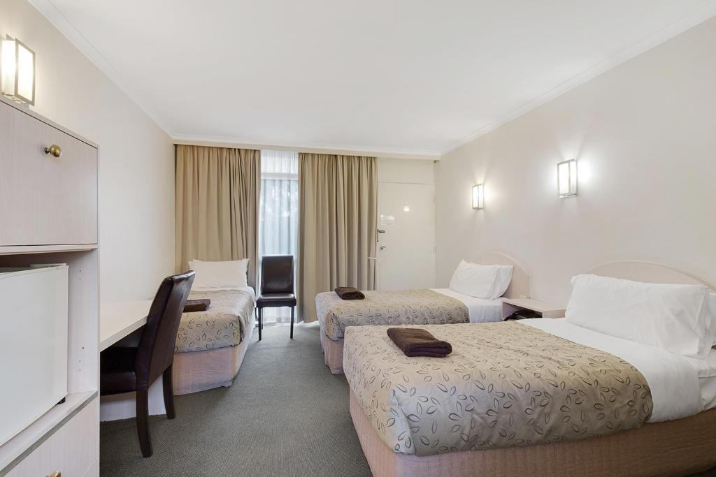 Postel nebo postele na pokoji v ubytování Alexander Motor Inn