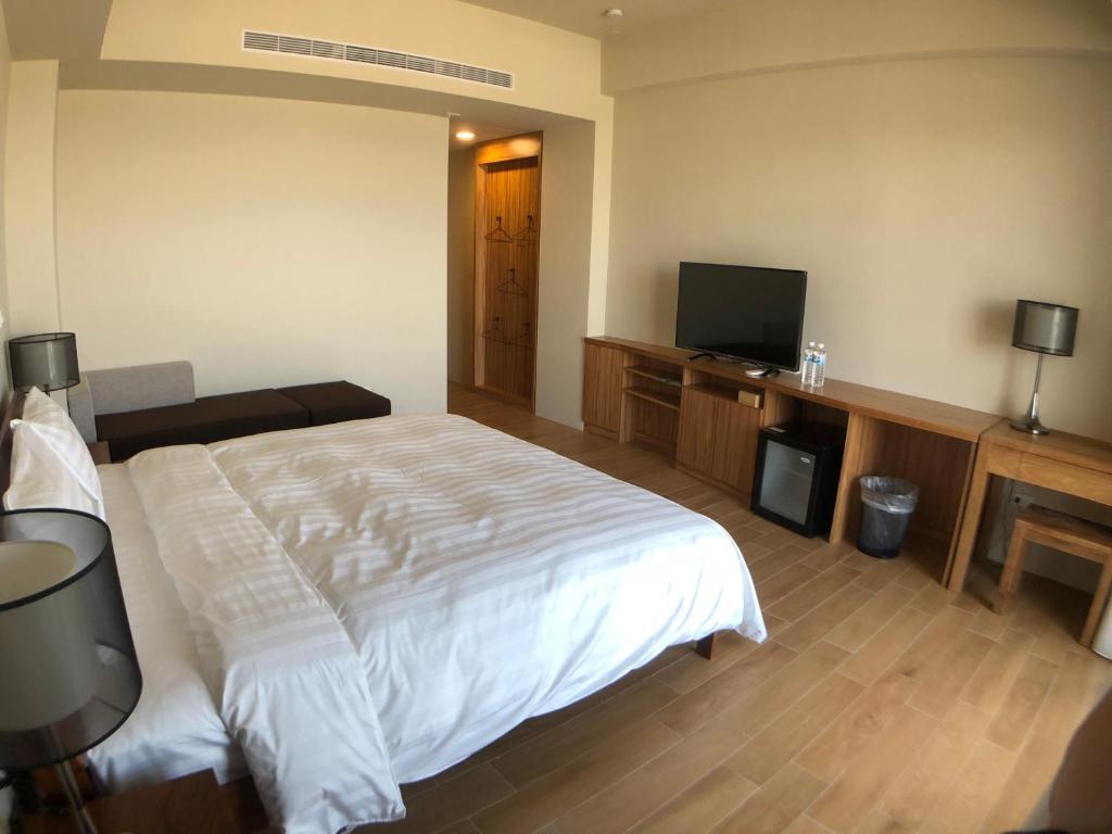 Postel nebo postele na pokoji v ubytování Hygge Homestay
