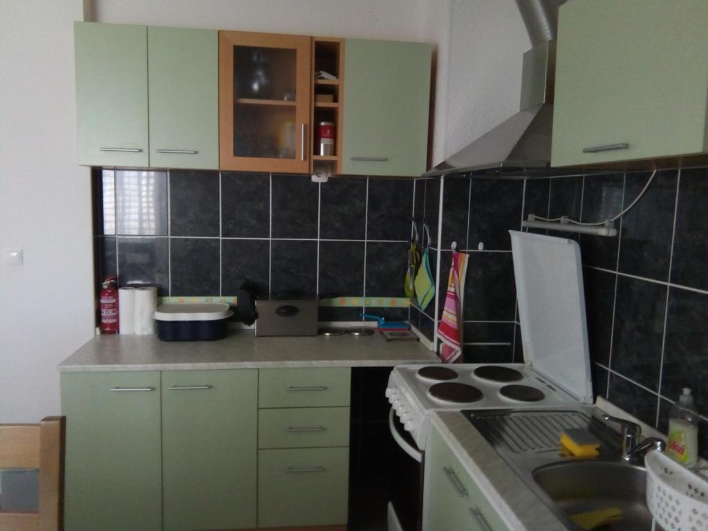 Kuchyňa alebo kuchynka v ubytovaní Apartman GRL