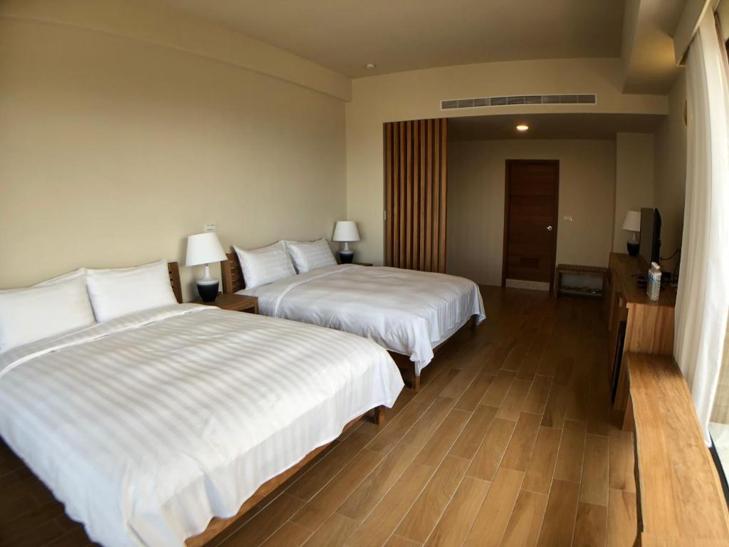 Postel nebo postele na pokoji v ubytování Hygge Homestay