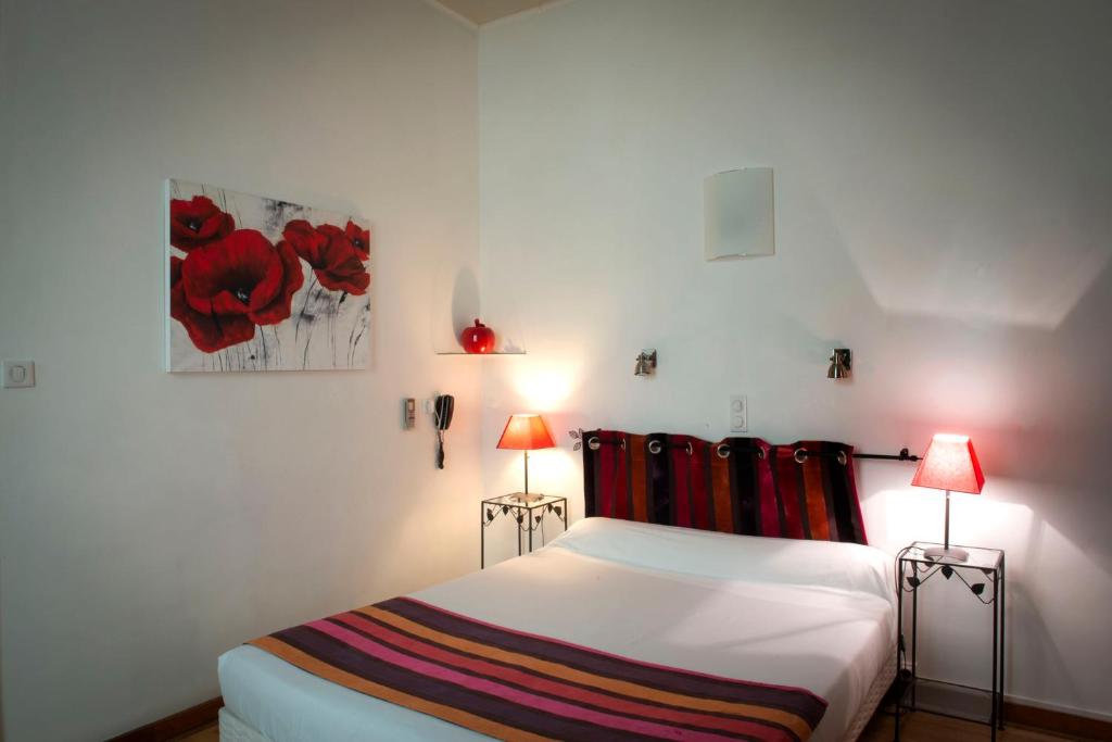 Postel nebo postele na pokoji v ubytování Hotel Du Forum