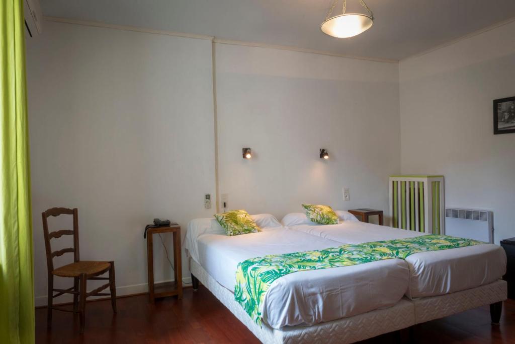 Postel nebo postele na pokoji v ubytování Hotel Du Forum