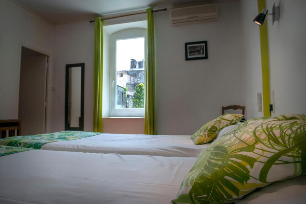 Postel nebo postele na pokoji v ubytování Hotel Du Forum
