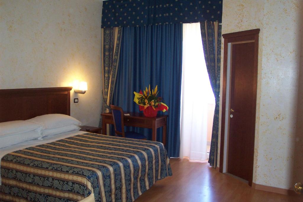 Postel nebo postele na pokoji v ubytování Hotel Alexander Resort