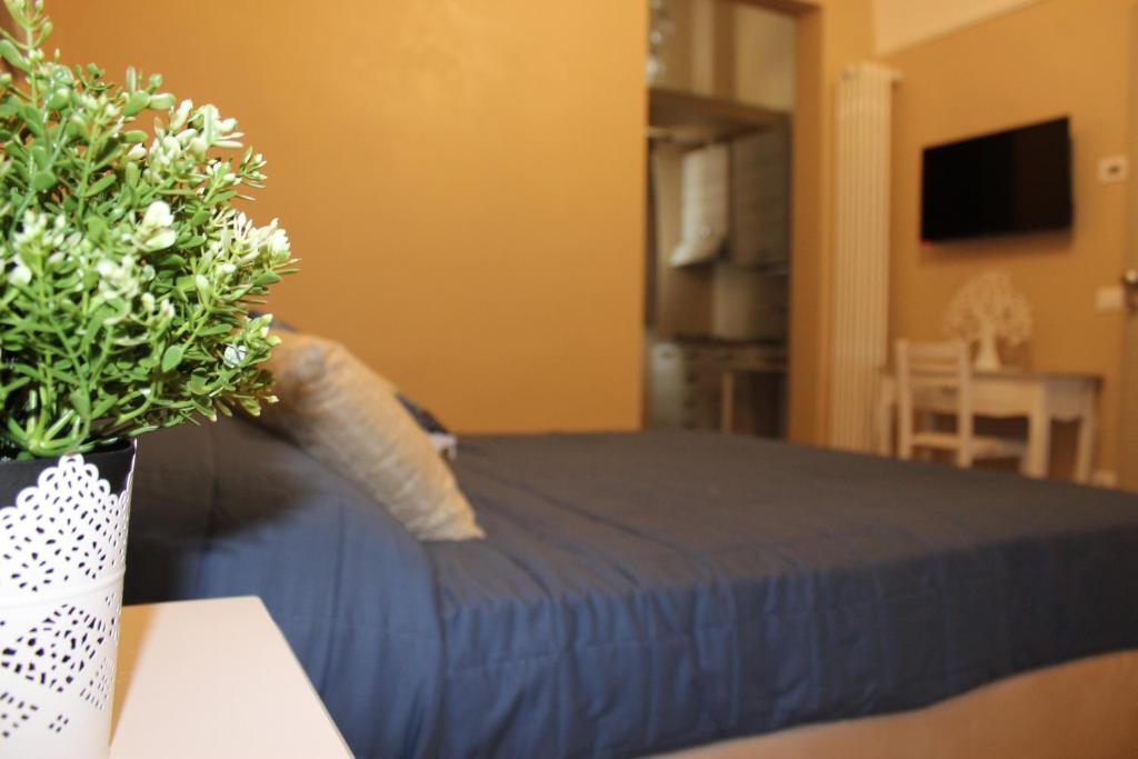 A bed or beds in a room at Dimora della Nonna