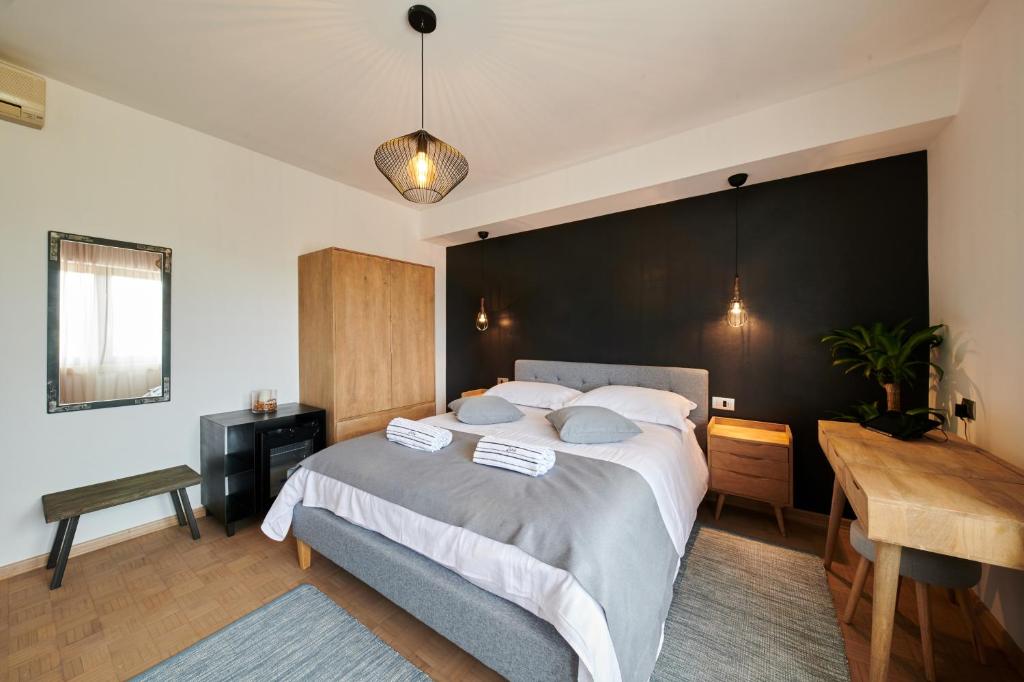 Ένα ή περισσότερα κρεβάτια σε δωμάτιο στο Boutique Rooms Luna