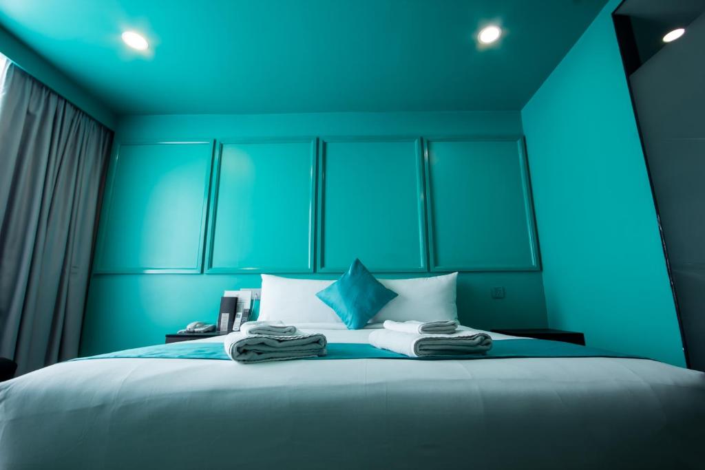 Postel nebo postele na pokoji v ubytování Bloommaze Boutique Hotel Puchong