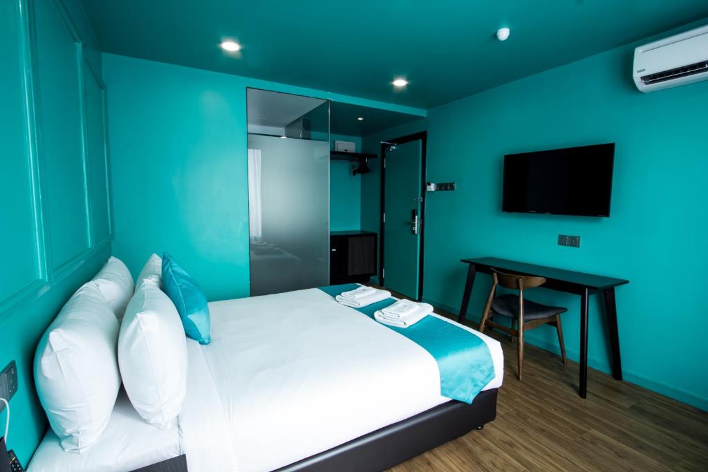 Postel nebo postele na pokoji v ubytování Bloommaze Boutique Hotel Puchong