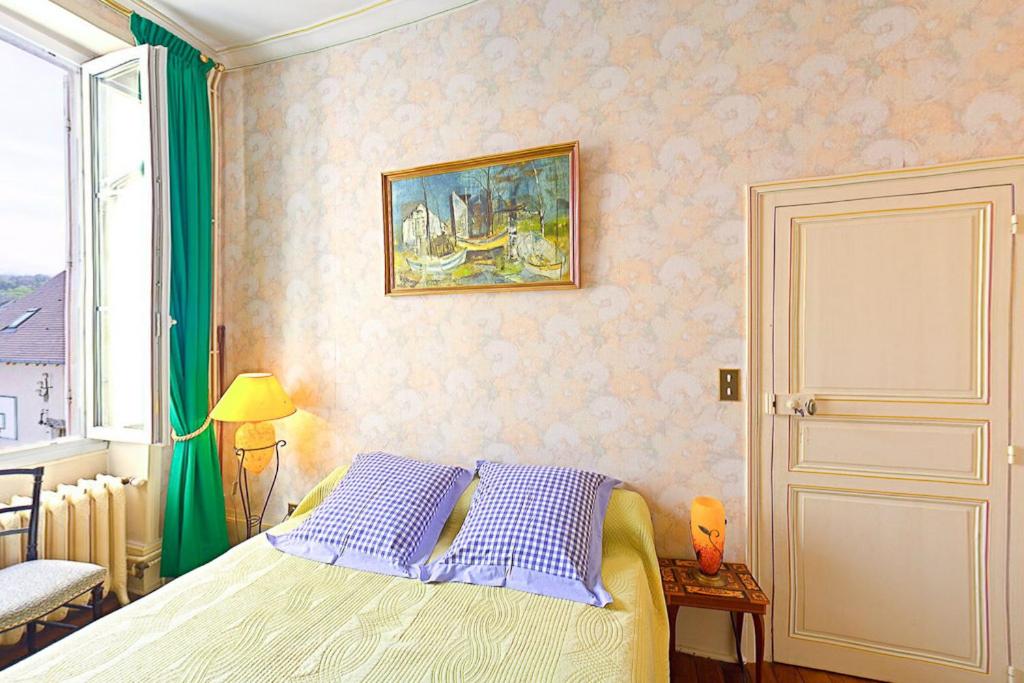 Postel nebo postele na pokoji v ubytování Amphore du Berry