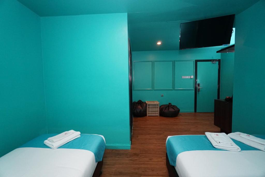 Postel nebo postele na pokoji v ubytování Bloommaze Boutique Hotel Puchong