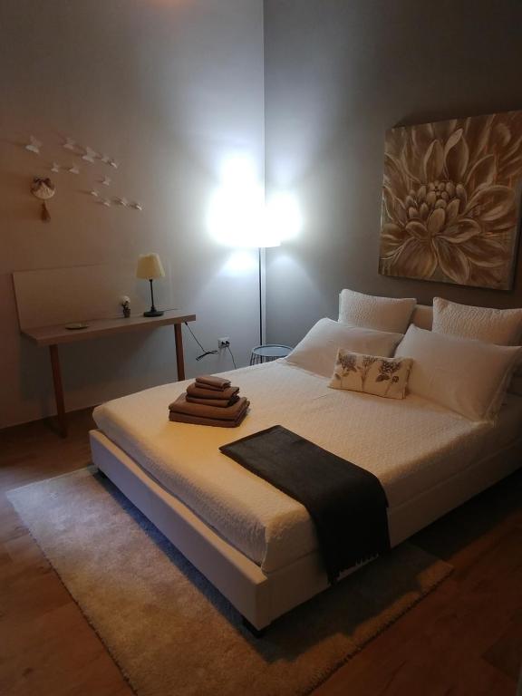Postel nebo postele na pokoji v ubytování Diadumeno Superior Apartment