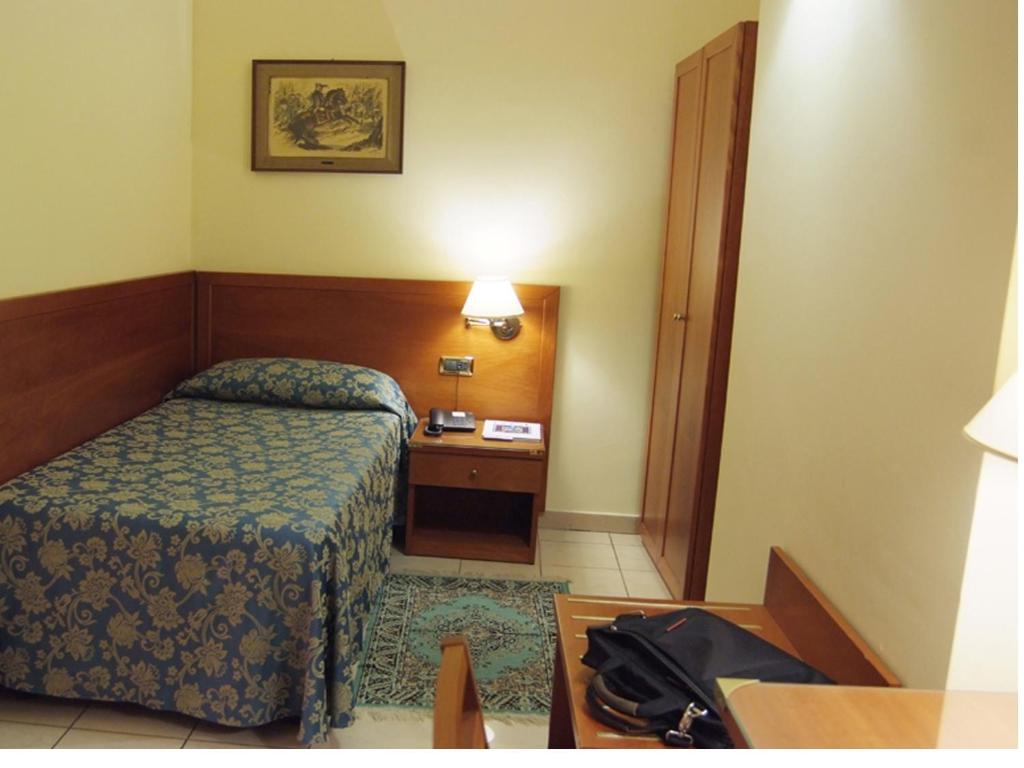 Postel nebo postele na pokoji v ubytování Hotel Adria