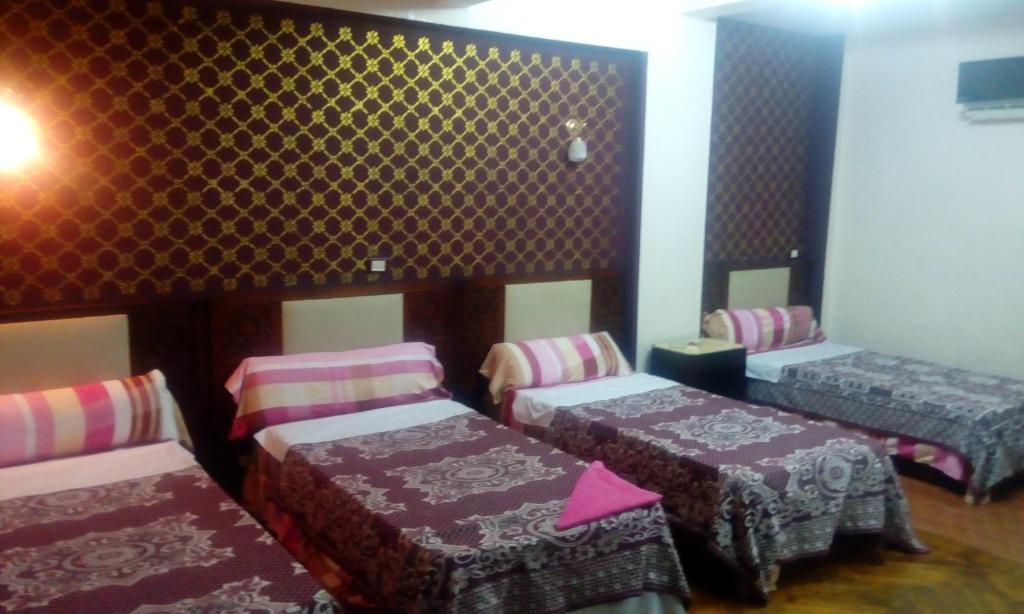 Postel nebo postele na pokoji v ubytování Cairo Moon Hostel