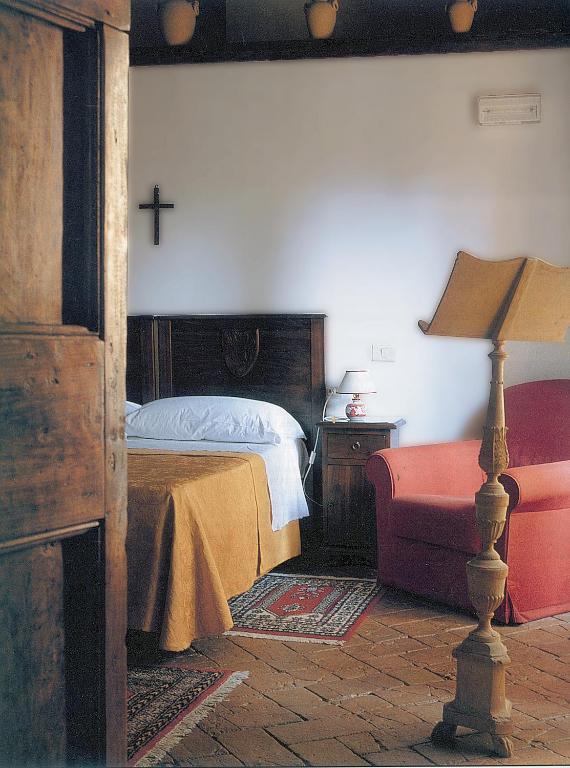 Postel nebo postele na pokoji v ubytování Abbazia San Pietro In Valle