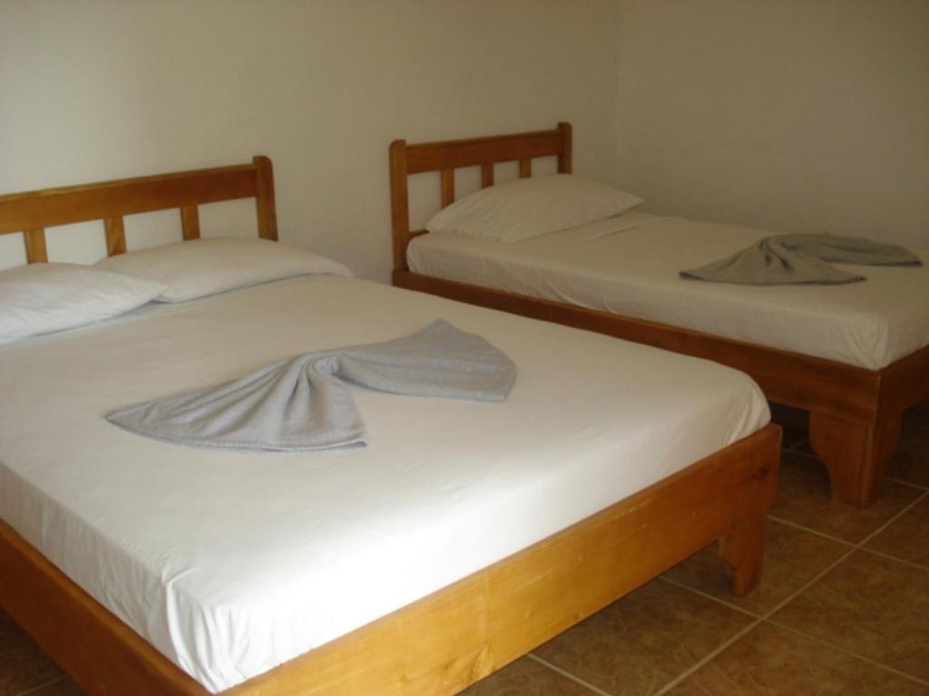 Postel nebo postele na pokoji v ubytování Mapi's Cabins