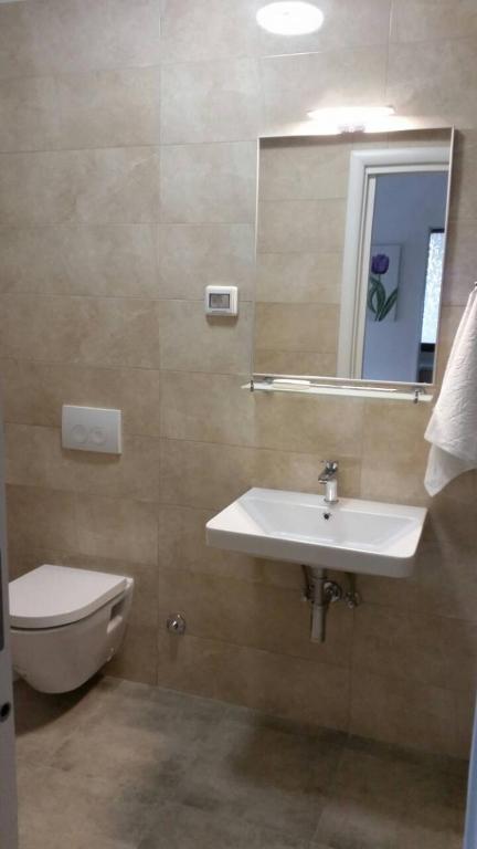 Łazienka w obiekcie Apartments Spada