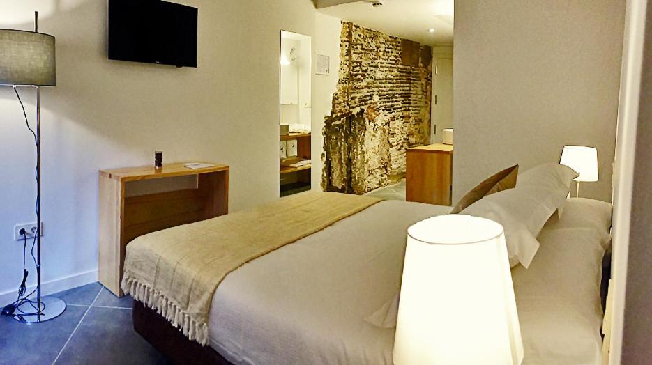 Postel nebo postele na pokoji v ubytování Hotel Secrets Priorat
