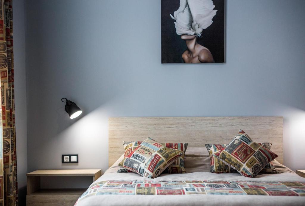 Postel nebo postele na pokoji v ubytování Aparthotel on Rynok Square