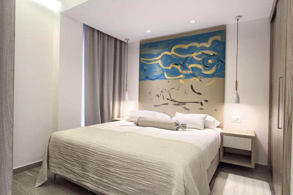 Postel nebo postele na pokoji v ubytování Kalamota Beach House