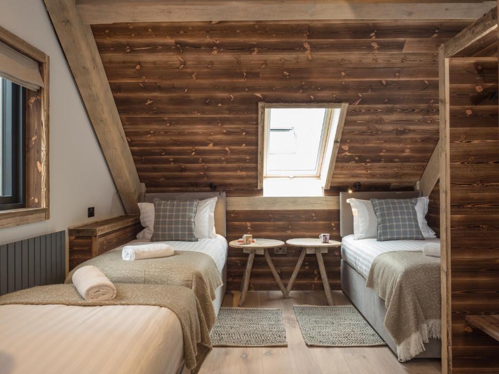 Tempat tidur dalam kamar di Cairngorm Lodge