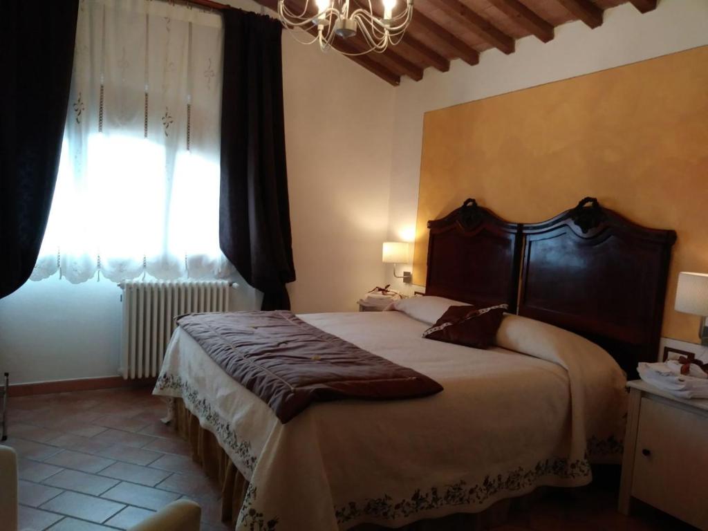Postel nebo postele na pokoji v ubytování B&B la Concordia