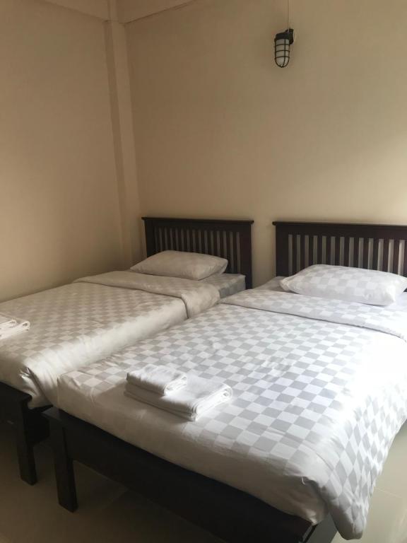 Postel nebo postele na pokoji v ubytování Baan Bon Resort Bang Tabun