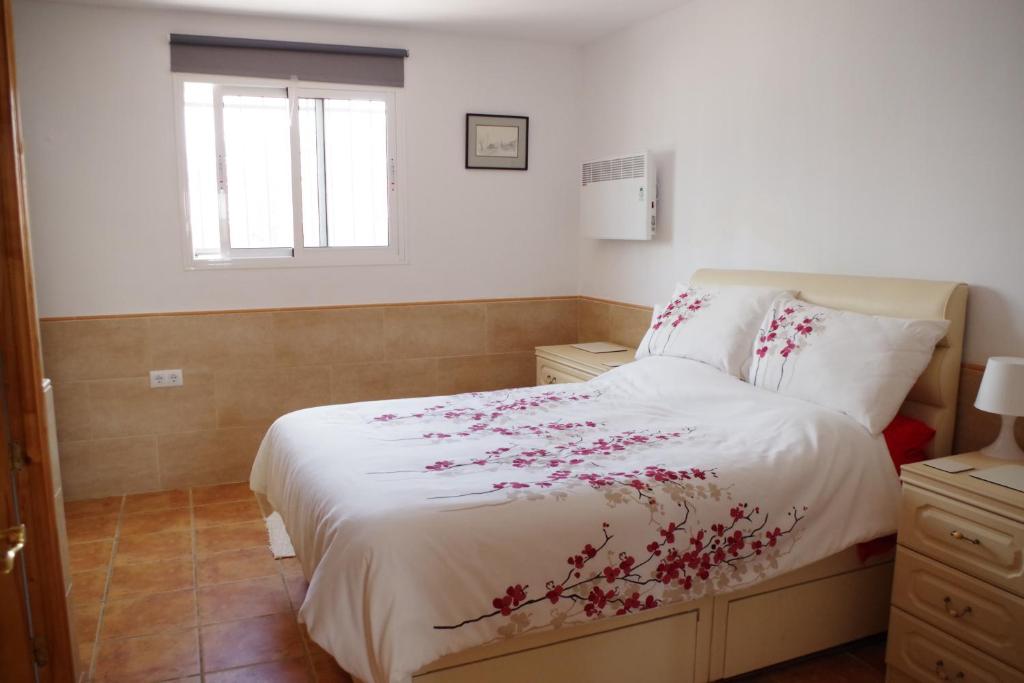 Posteľ alebo postele v izbe v ubytovaní Casa Leonora